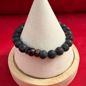 Waterproof and Tarnish free. Lava rocks and tiger eye beads accent this beauty.